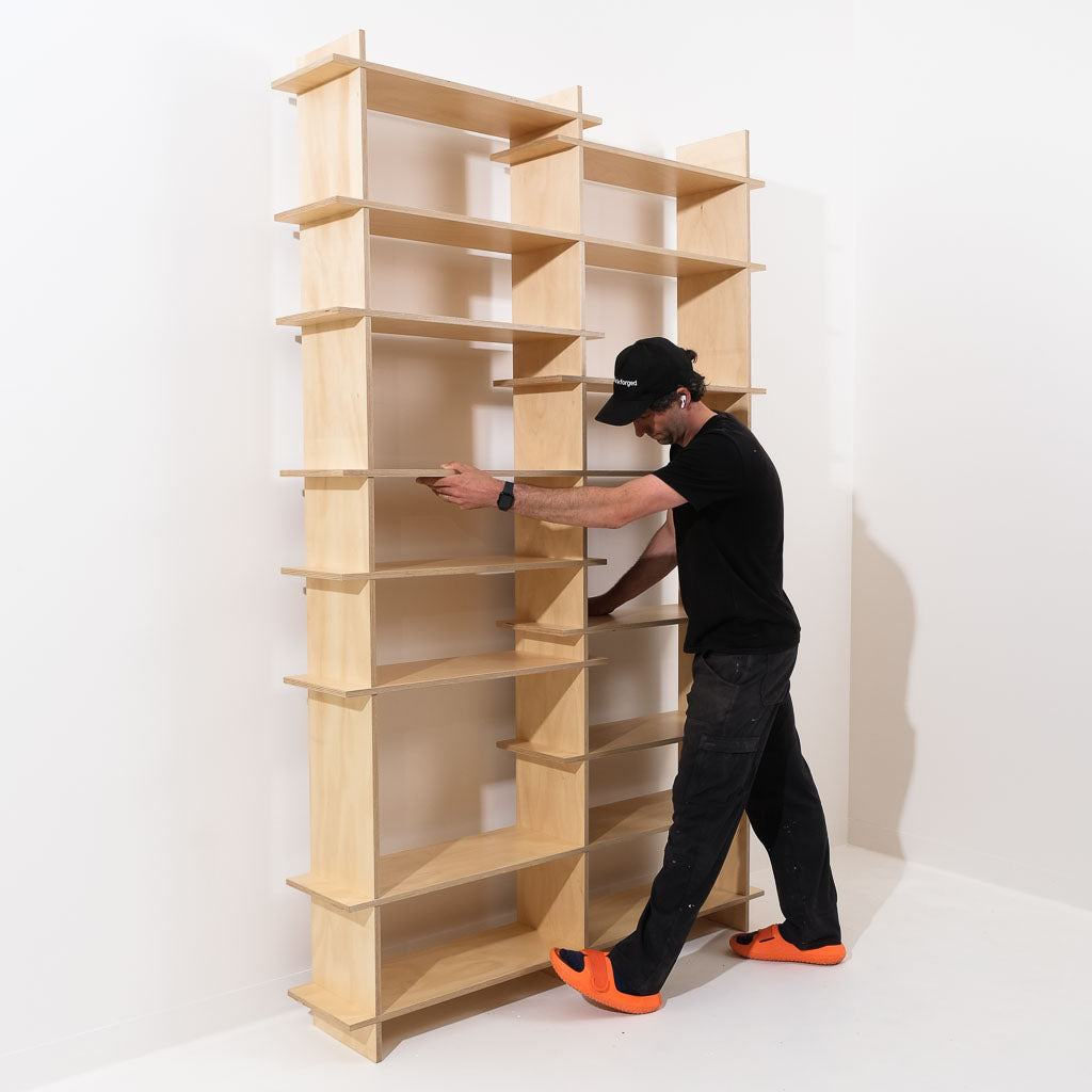 Jem moving The Shelves into place