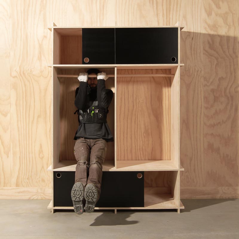 Jem testing the strength of some custom shelves